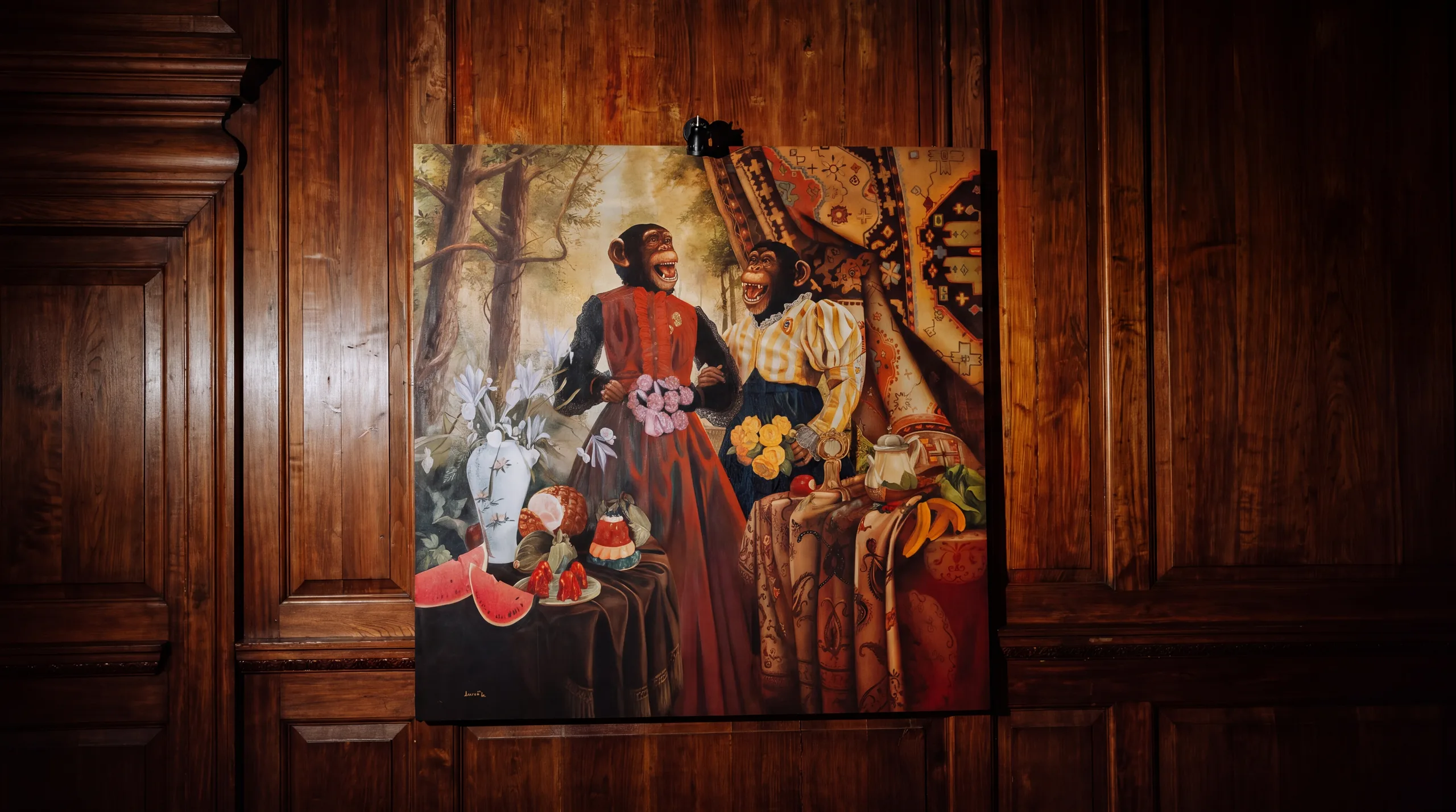 Painting of two chimpanzees on a wood-panelled wall