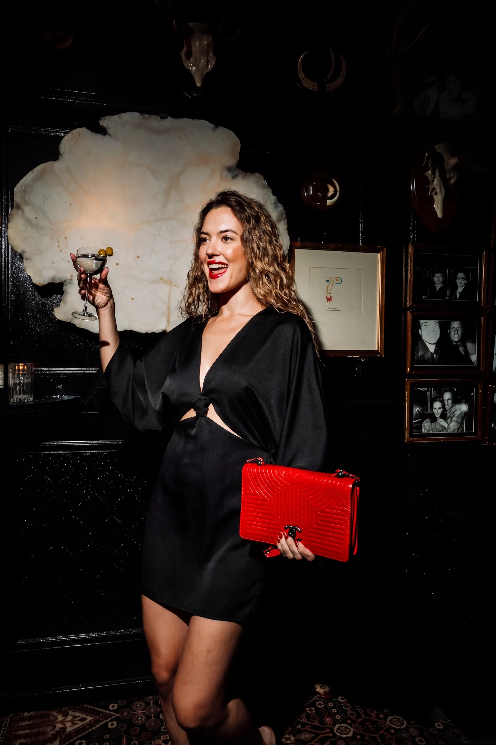 Guest toasting with a martini in the Boca Grande salon
